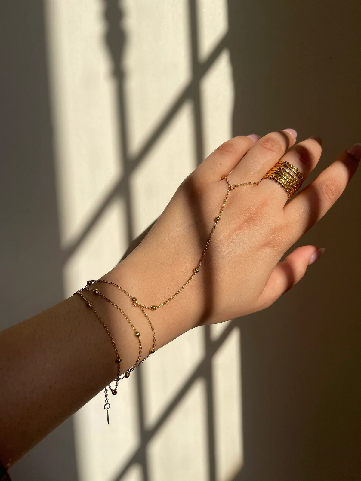 Double layered gold hand chain